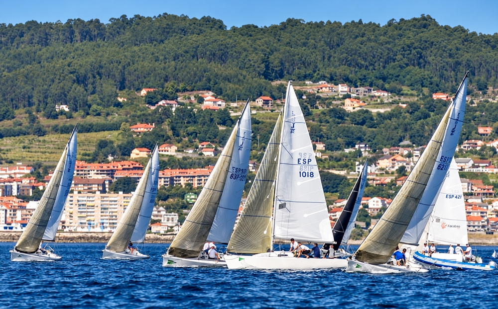 J/80s sailing upwind off Sanxenxo, Spain