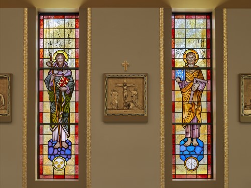 Detail of the stained glass and surrounding paint and decoration.