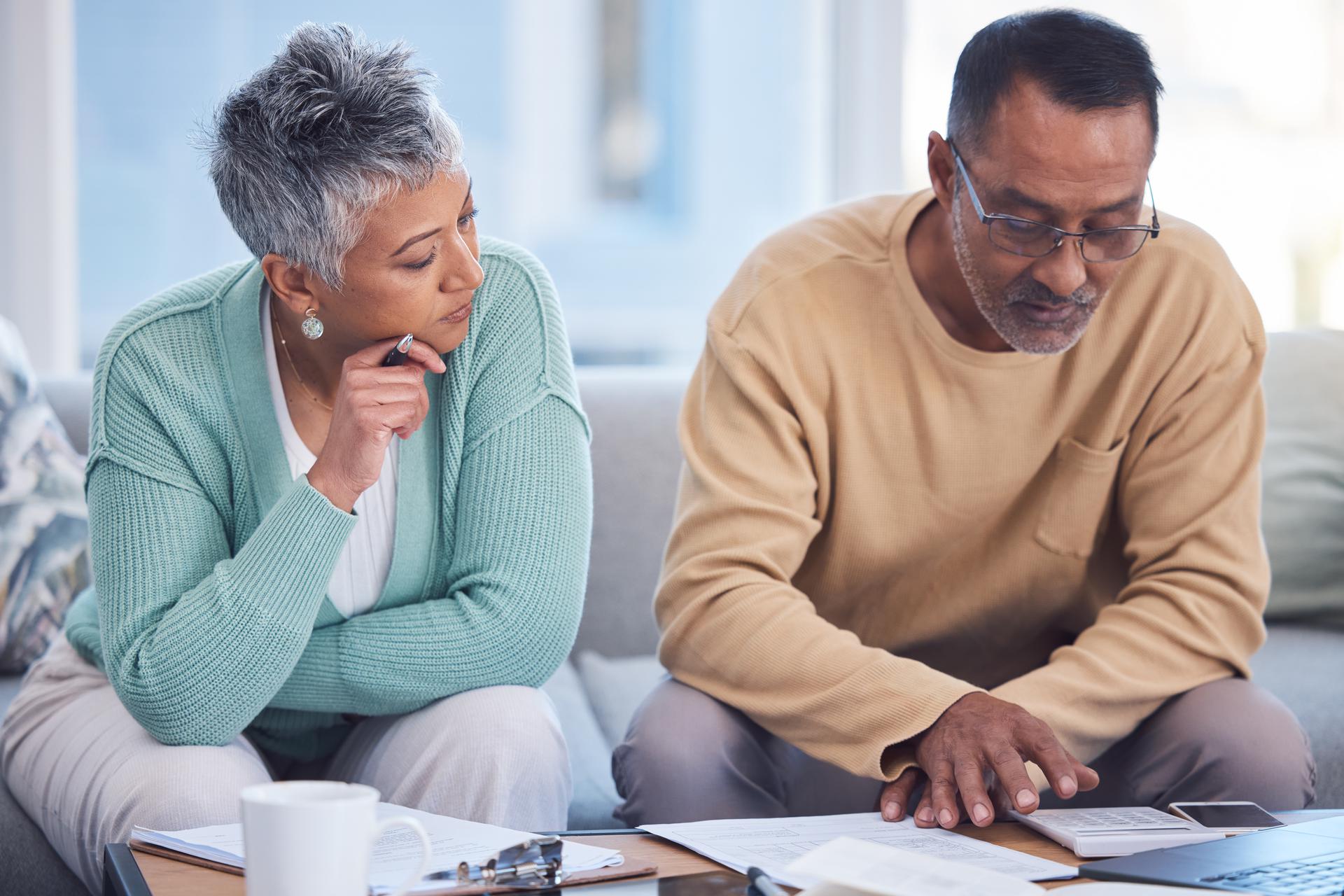 Mature couple looking at Social Security documents